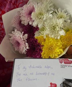 Nkubi Finally Goes Romantic, Gifts Wife Her First Flowers After Online Backlash